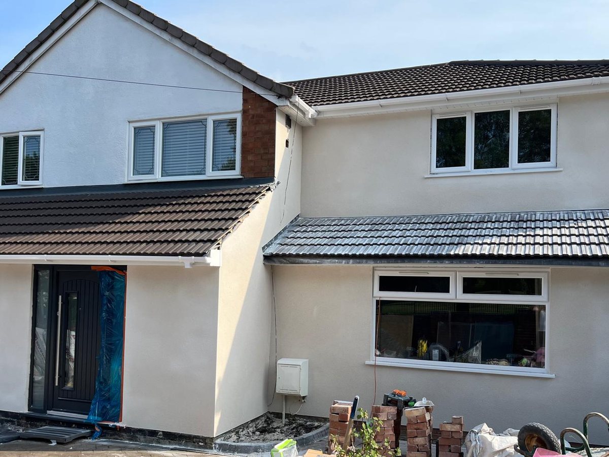 House exterior fully rendered by Express Plastering, smooth cream finish